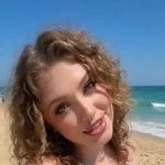 At the beach suntanning