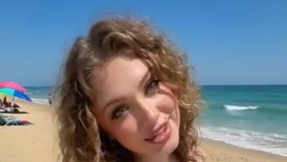 At the beach suntanning